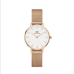 Rose gold Daniel Wellington watch.